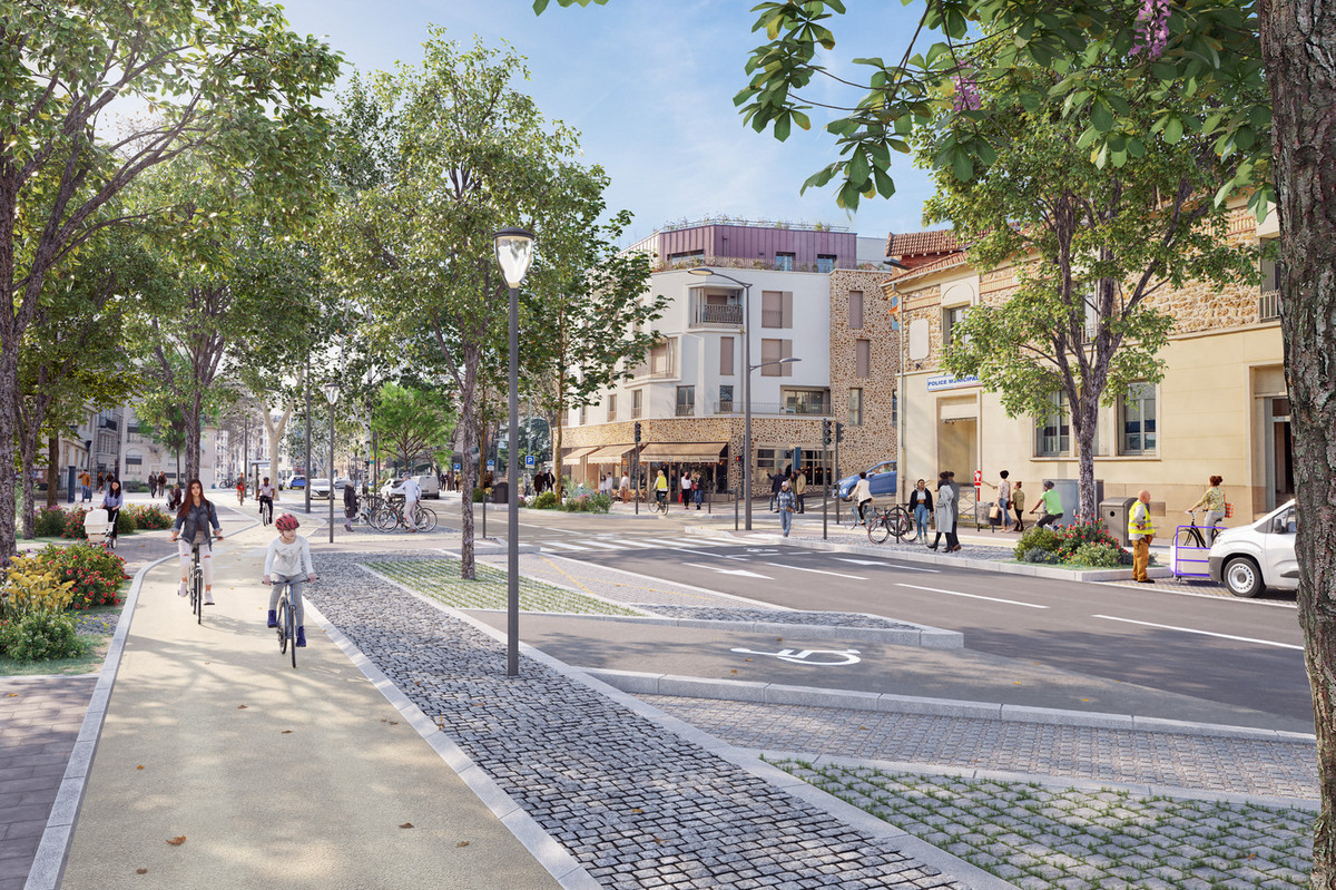 Une large piste cyclable, protégée des piétons et de la circulation, aménagée de chaque côté de l'avenue